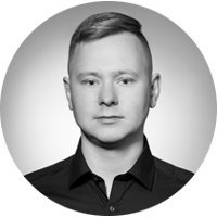 A black&white portrait photo of the owner of this website, Michał Wojtas